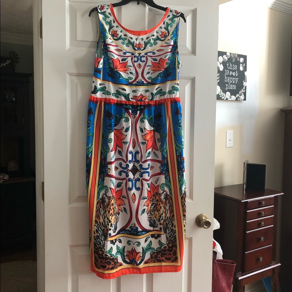 Sleeveless polyester animal print dress no lining.